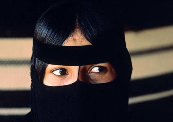 Photo: A young Bedouin woman wearing a veil